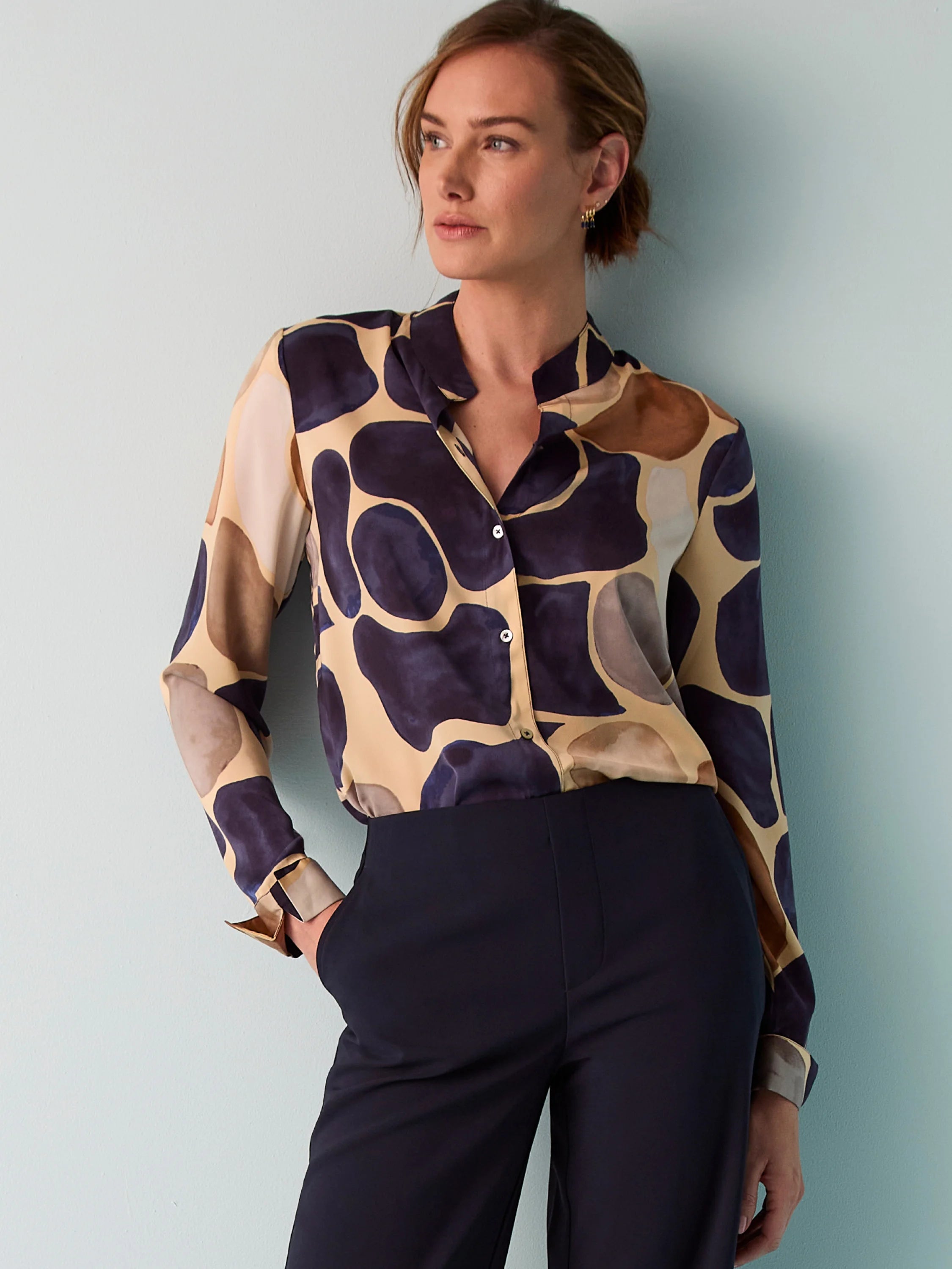 Beige long-sleeve button-down shirt with dark purple, brown, and gray abstract pebble print.