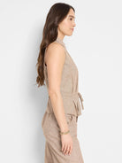 Beige sleeveless linen-cotton vest with self-tie belt.  Slight texture.