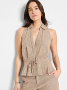 Beige linen-cotton sleeveless vest.  V-neck, collared, drawstring waist.  Subtle textured fabric.