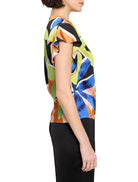 Here's alt text under 125 characters:

Short-sleeved blouse,  blue, green, orange, and black abstract print. Flutter sleeves.