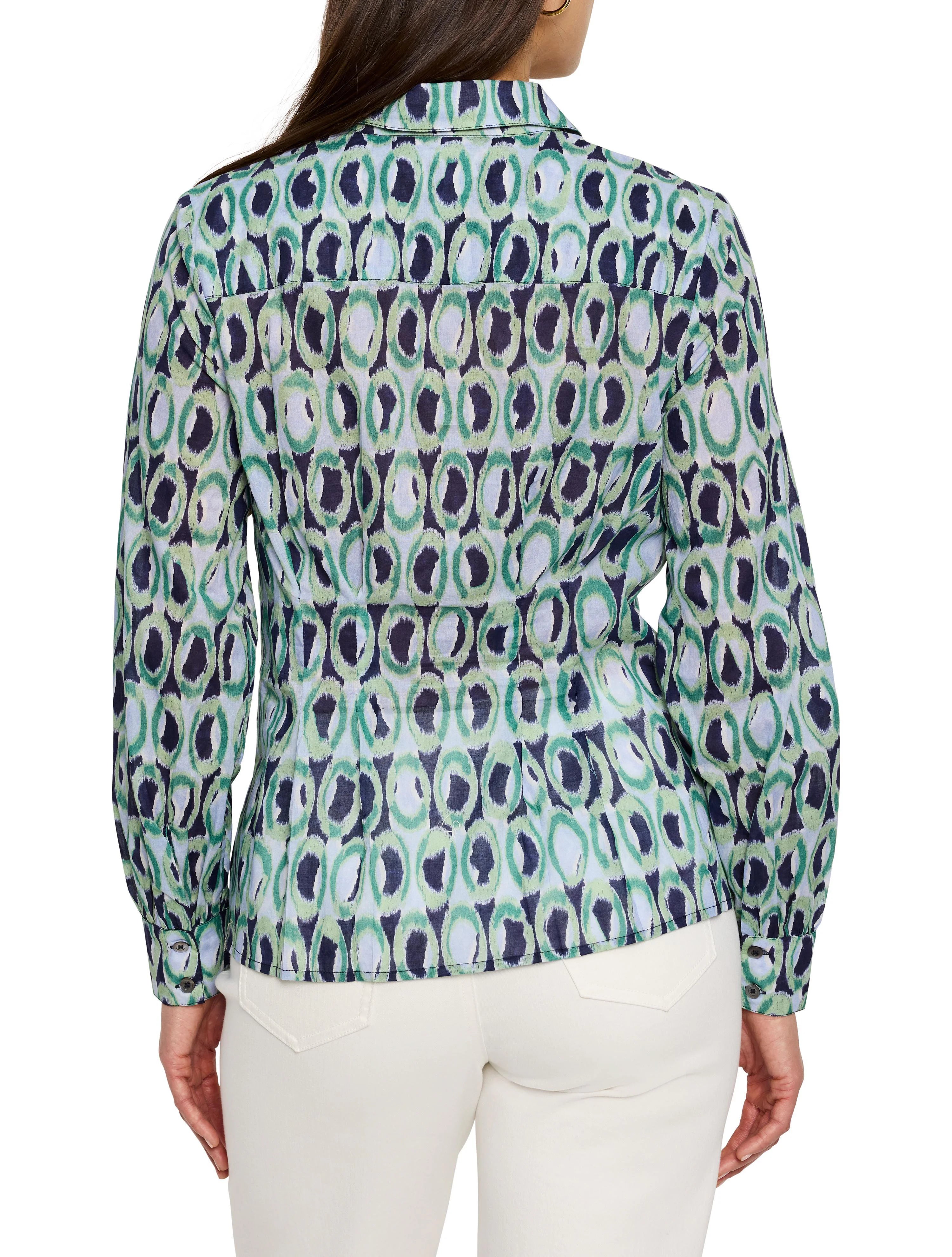 Green, blue, and white patterned shirt.  Repeating ring design. Long sleeves, collared.