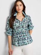 Green, blue, and white ring-patterned, collared, 3/4 sleeve button-down shirt.