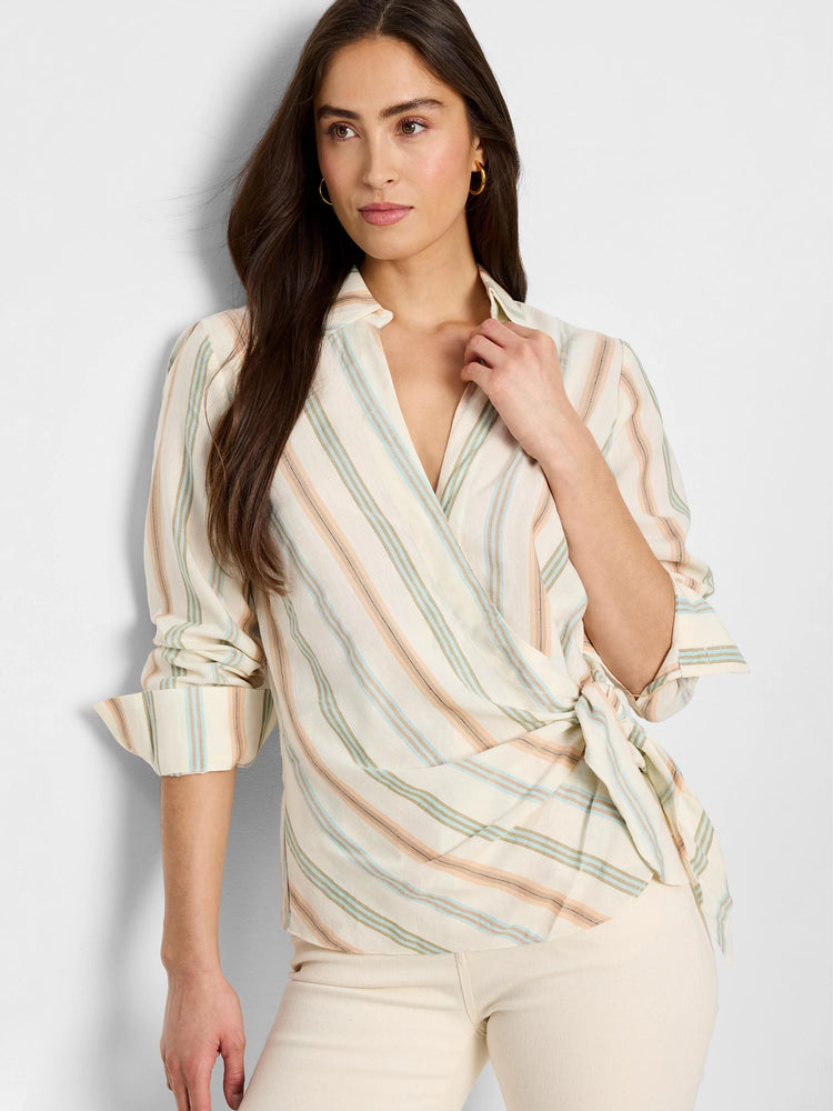 Cream top with diagonal stripes in peach, light blue, and olive green.  Wrap style with a self-tie. Three-quarter sleeves.