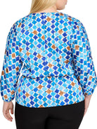 Blue, brown, and white mosaic-print top with 3/4 sleeves.  The pattern features diamond shapes.