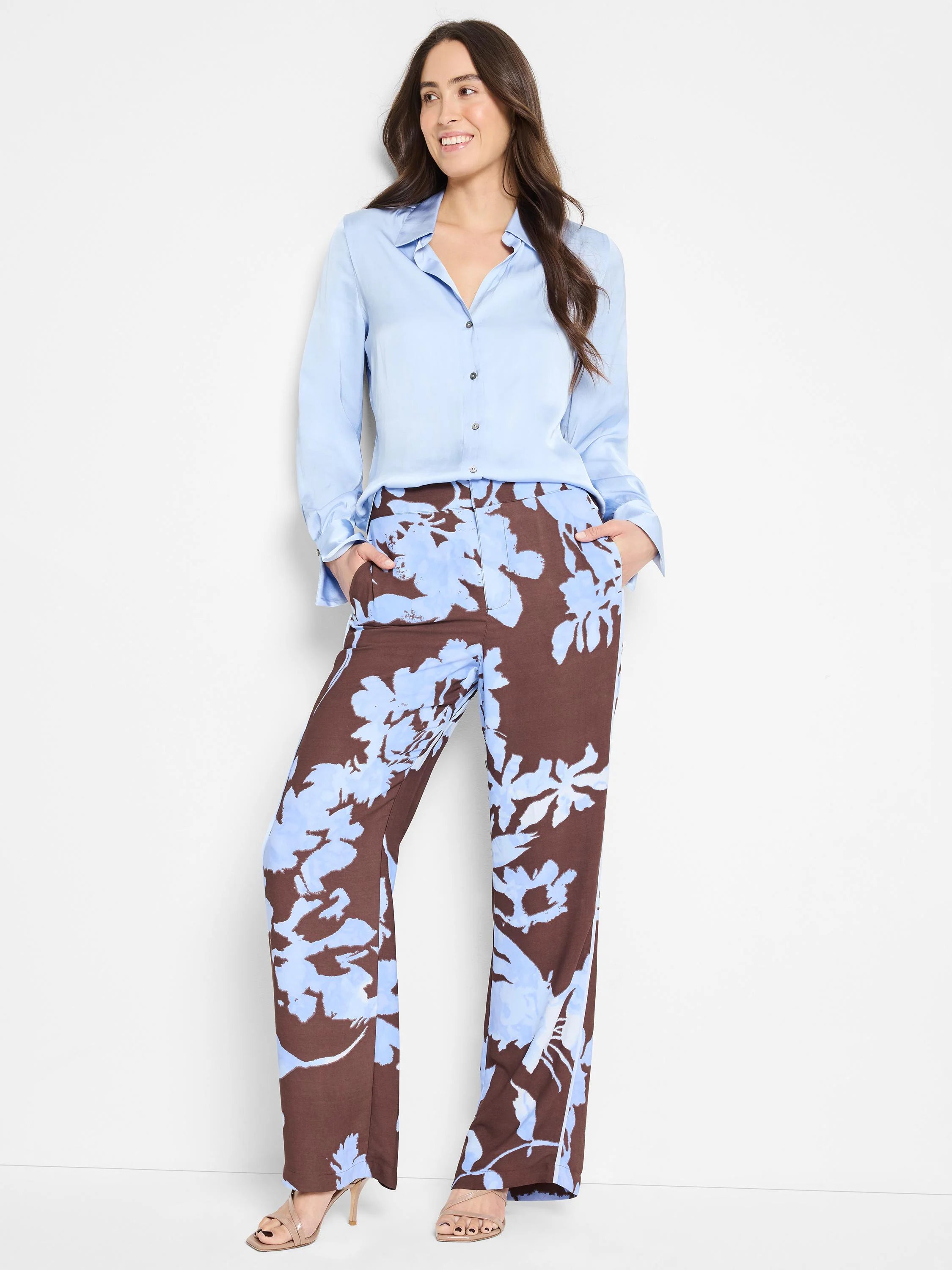 Light blue shirt, wide-leg pants with brown and light blue abstract floral print.