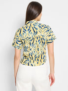Yellow shirt with blue & white woven pattern. Short sleeves, tie waist.