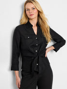 Black linen shirt; 3/4 sleeves, tie front, collared, two chest pockets, button closure.