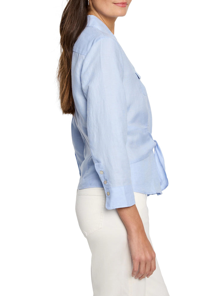 Light blue, tie-front shirt; three-quarter sleeves, button cuffs.