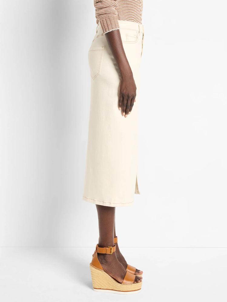Off-white denim midi skirt with a front slit.  Features visible stitching.