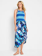 Blue, white, and black abstract print midi skirt with asymmetrical hem and ruching at the side.