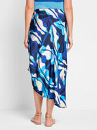 Blue, turquoise, and beige abstract print midi skirt. Asymmetrical hemline.