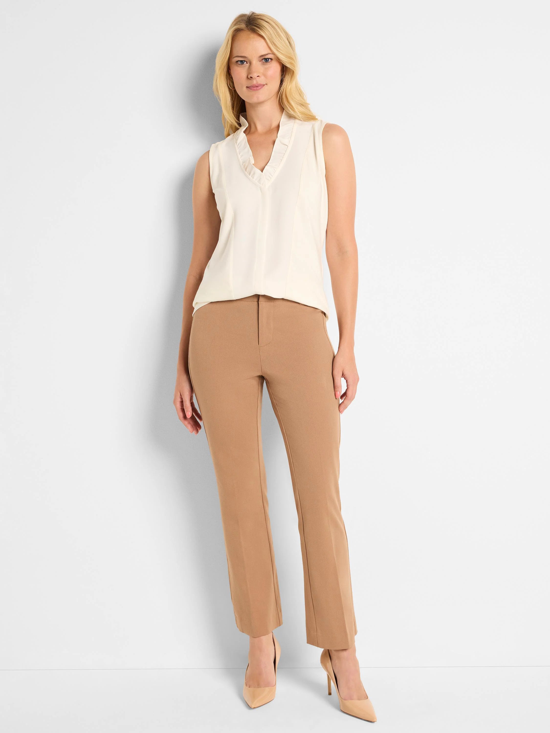 Tan demi boot pants on a model. Smooth fabric, flat front with visible front leg creases.