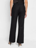 Black linen-cotton wide-leg pants; rear view.  High-waisted, flat front.