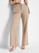 Beige linen-cotton wide-leg pants; textured fabric.
