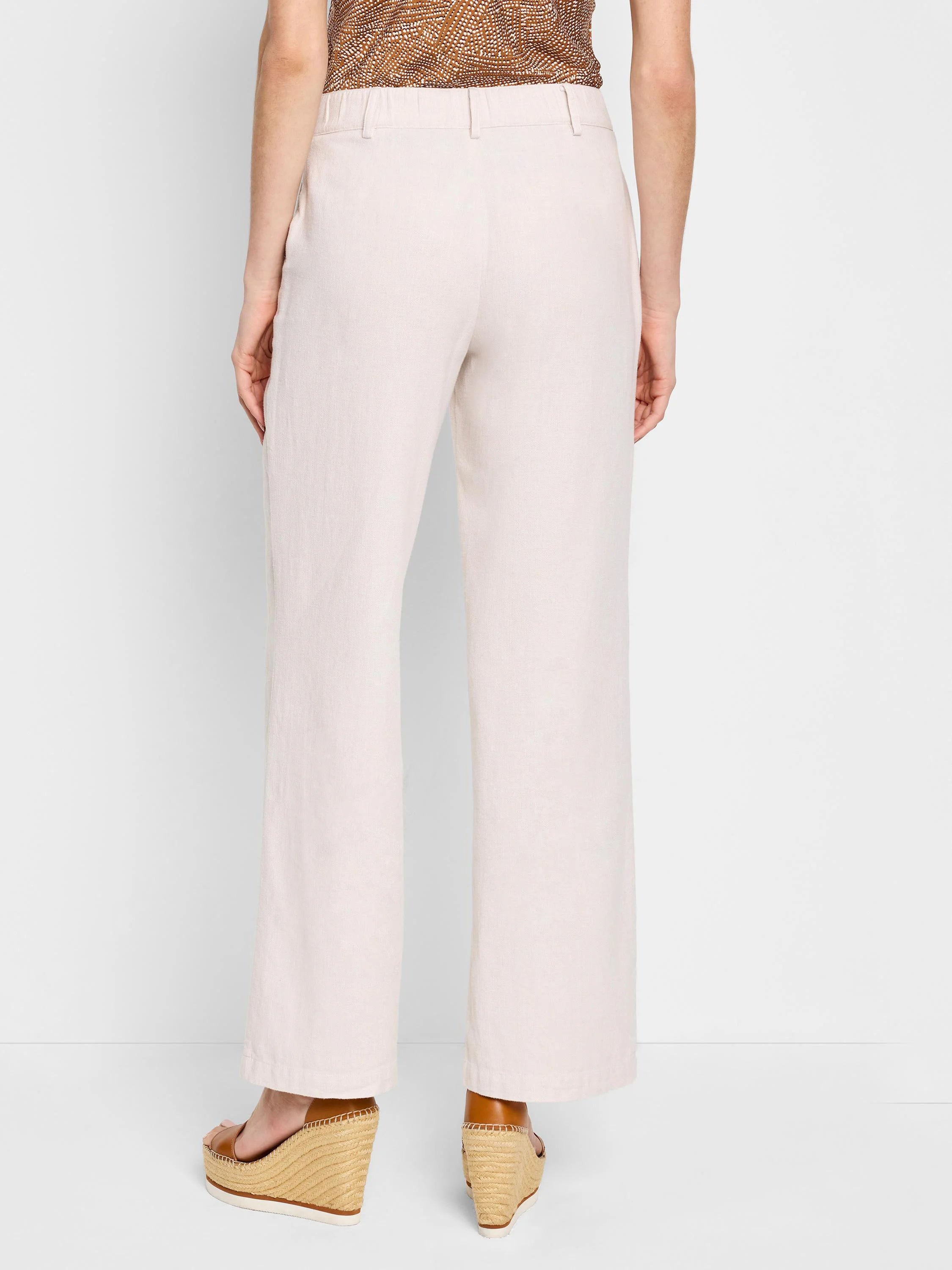 Off-white wide-leg linen cotton pants; back view.  Pockets visible.