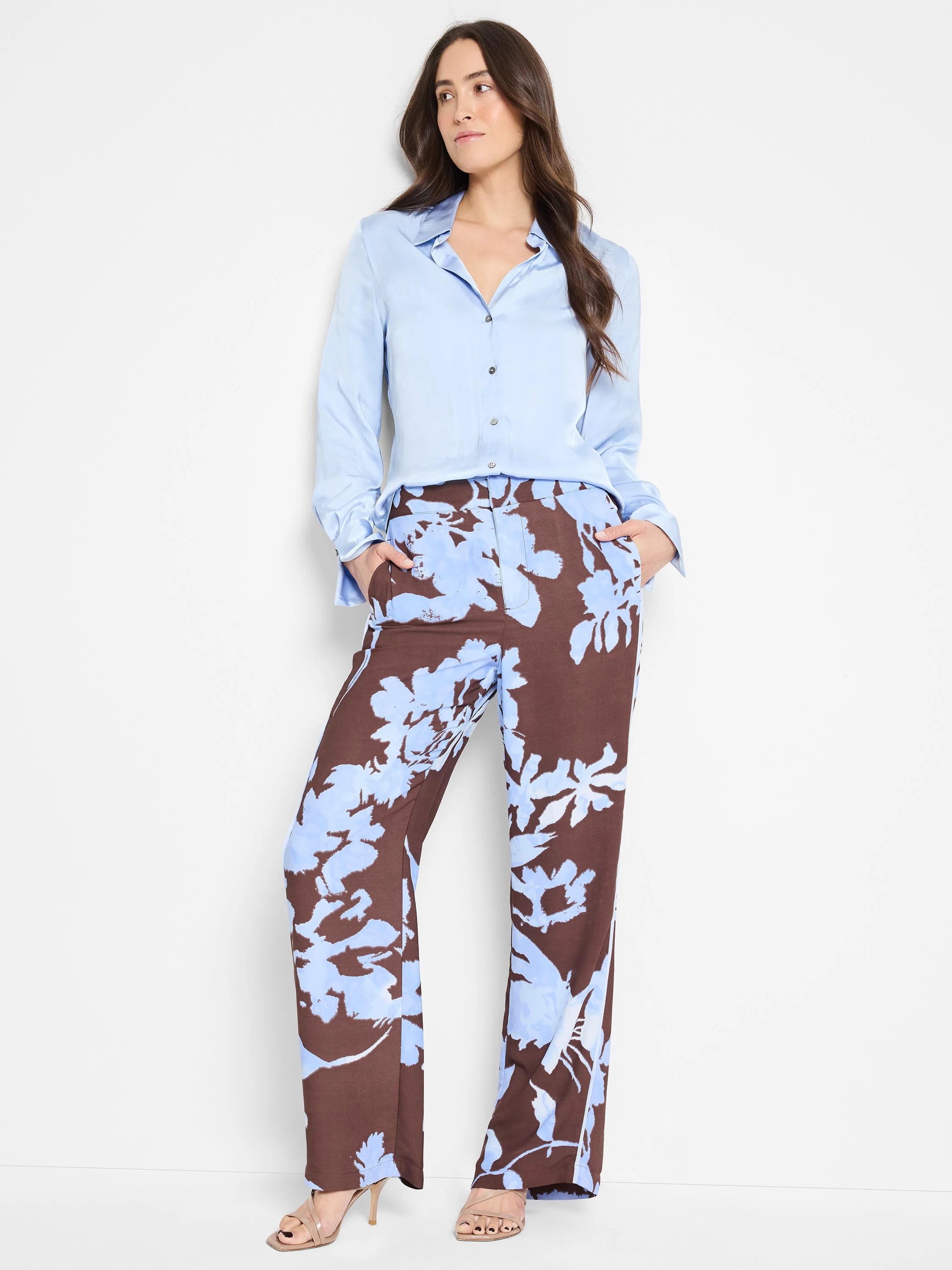 Wide-leg pants; brown background with light blue abstract floral pattern.