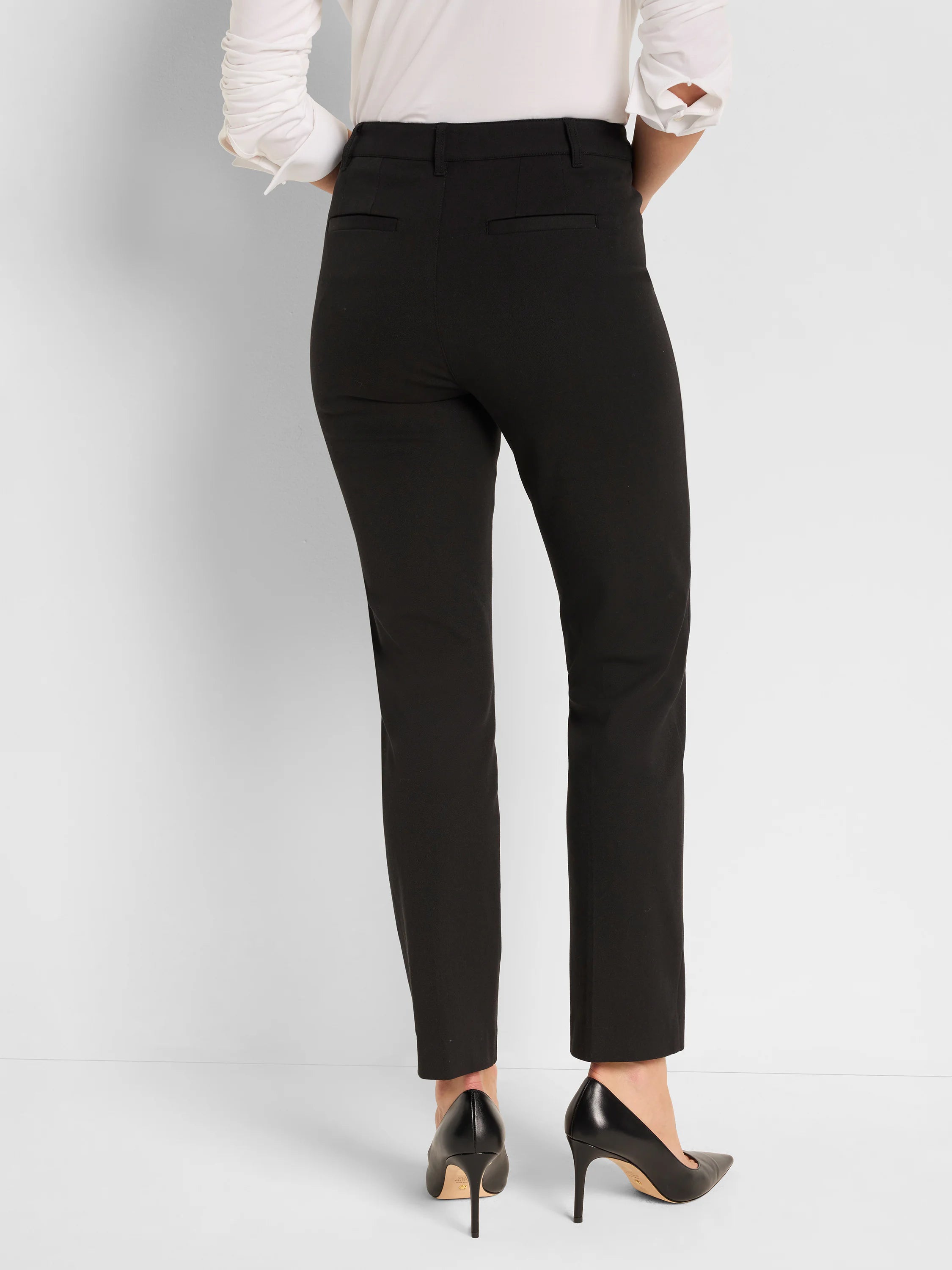 Black straight pants, modeled from behind. Features belt loops and two back welt pockets.