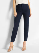 Smooth navy blue straight-leg pants with a flat front, cropped at the ankle, worn by a model.