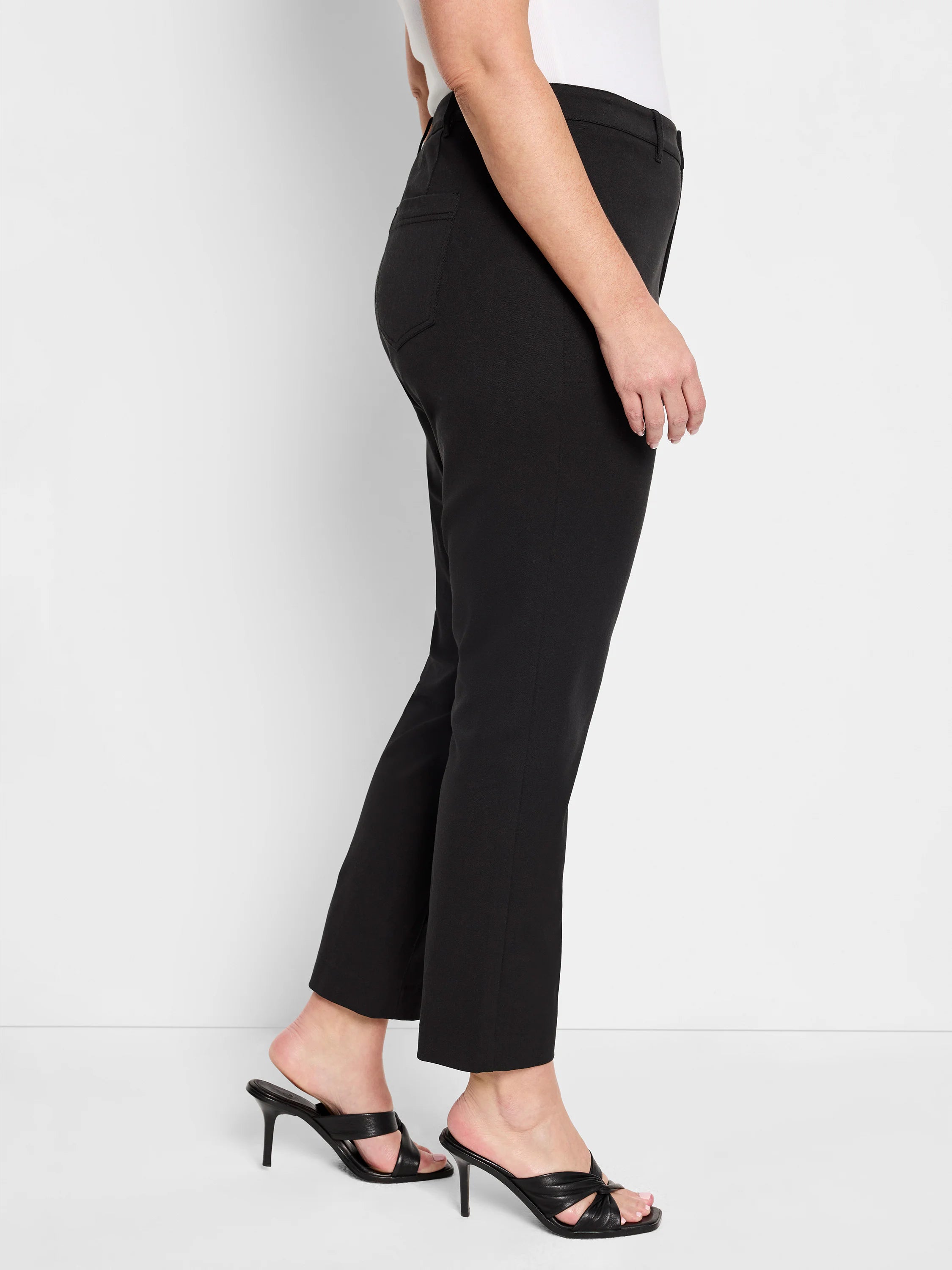 Black straight-leg ankle pants made of smooth fabric, featuring a subtle side pocket.