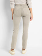 Light greige straight ankle jeans, shown from the back. Features detailed back pockets.