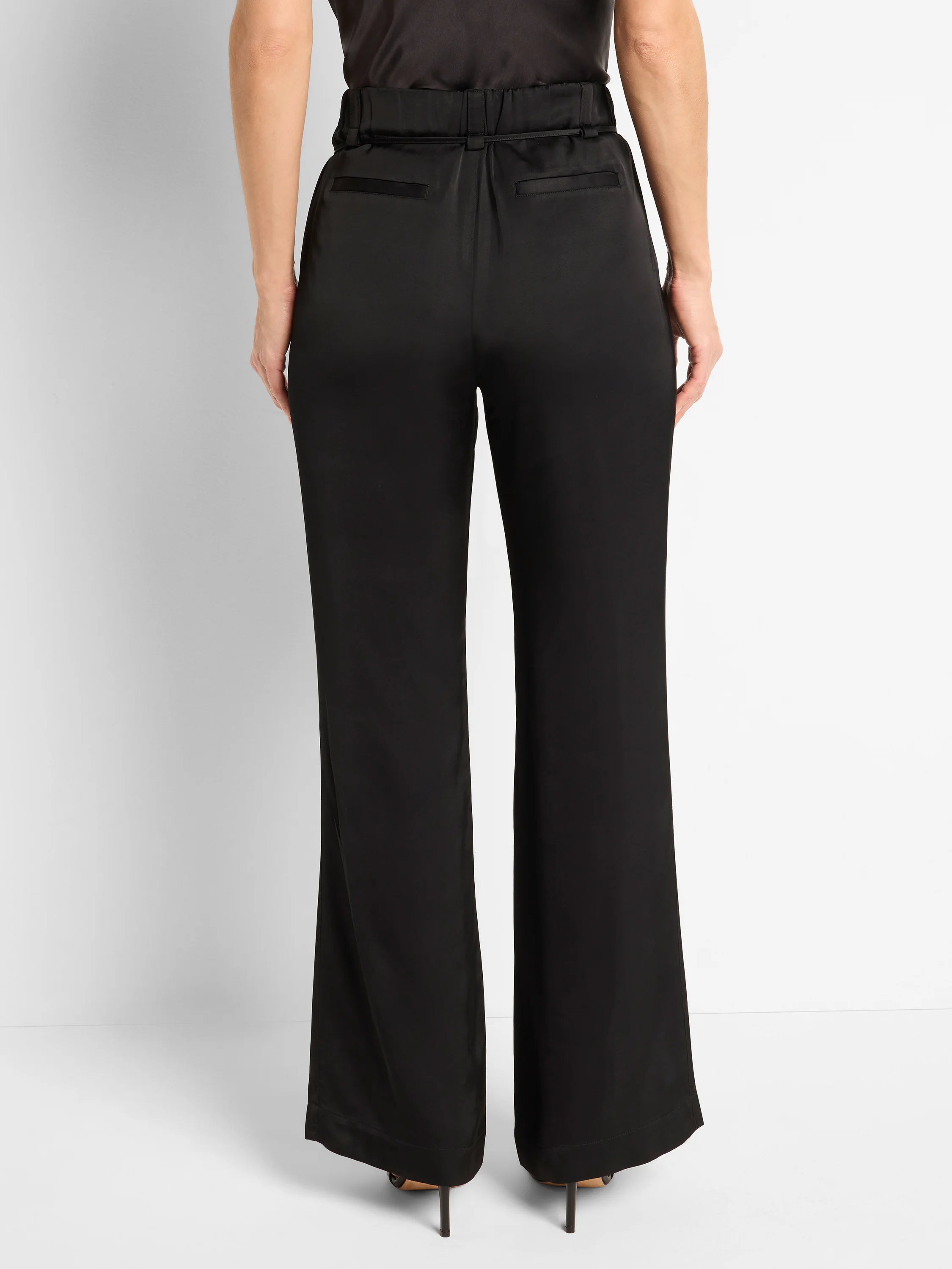 Black wide-leg pants with a front slit, elastic waistband, and back pockets.