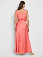 Coral pink maxi dress, sleeveless, V-neck, belted waist, A-line skirt.