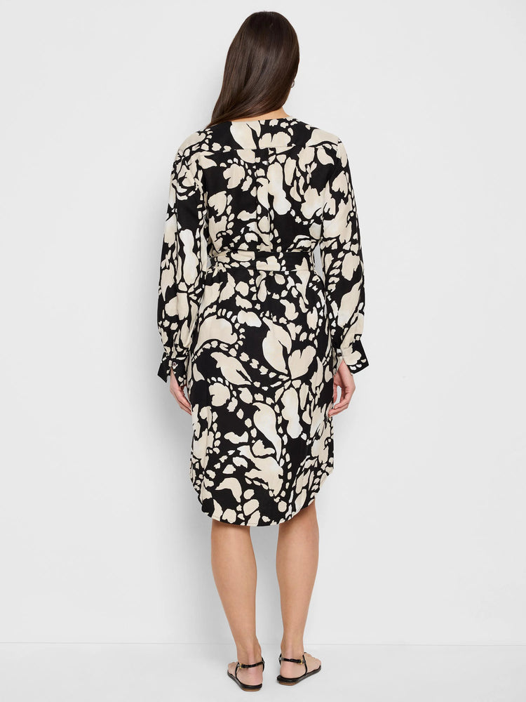 Black midi dress with beige abstract print, long sleeves, and a belted waist.