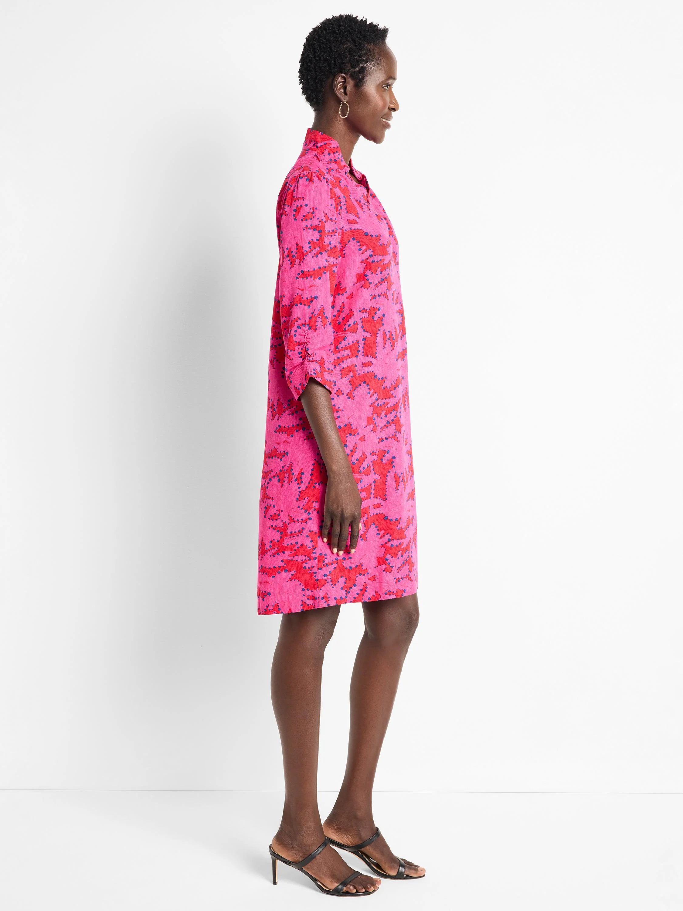 Pink shirt dress with red and blue abstract print. Three-quarter sleeves. Knee-length.