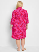 Pink dress with a red and navy floral pattern, three-quarter sleeves, and A-line silhouette.