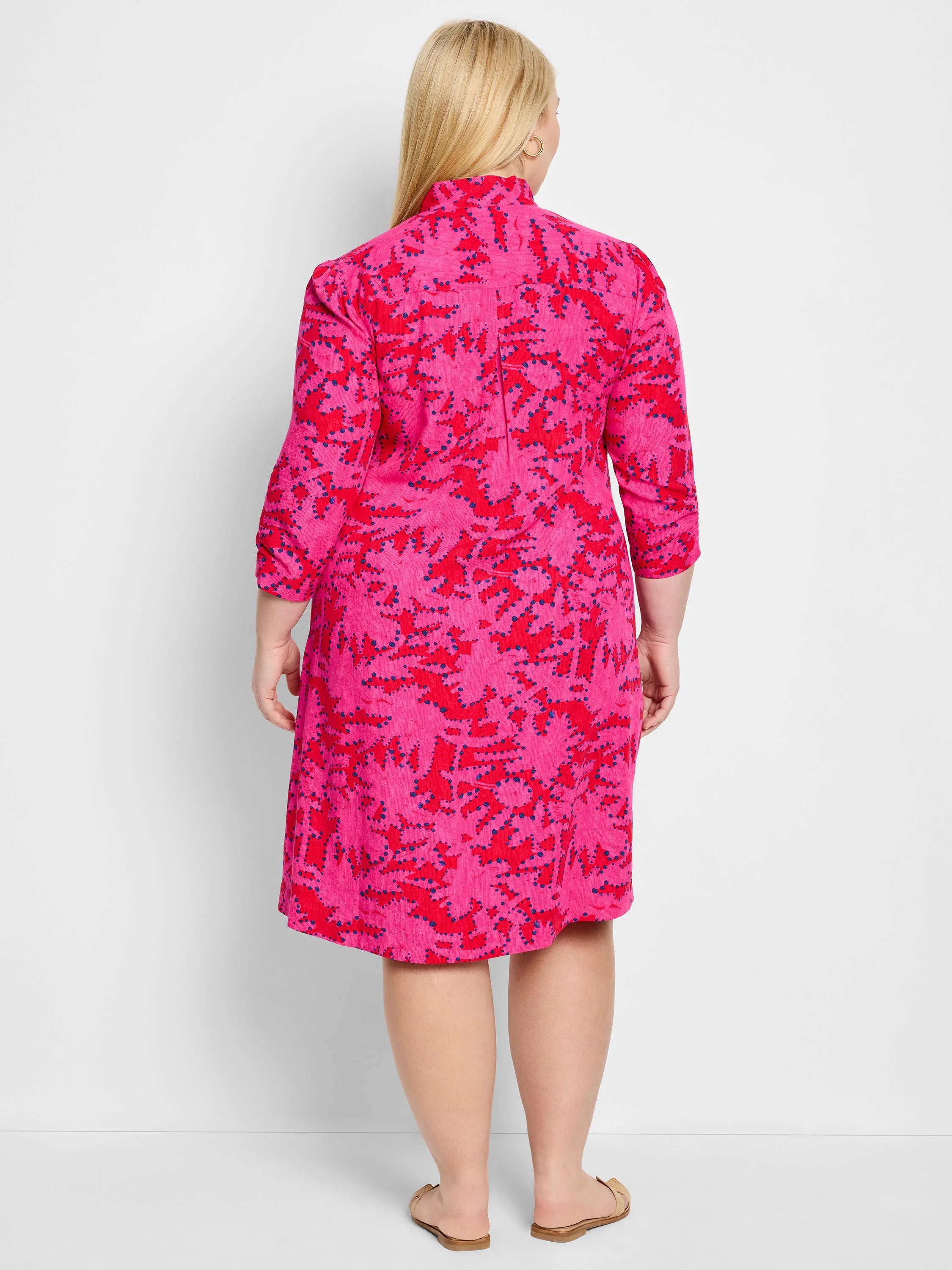 Pink dress with a red and navy floral pattern, three-quarter sleeves, and A-line silhouette.