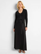 Black maxi dress with a matching ribbed cardigan.  The skirt is bias cut and flows to the floor.