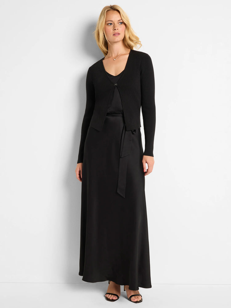 Black maxi dress with a matching ribbed cardigan.  The skirt is bias cut and flows to the floor.