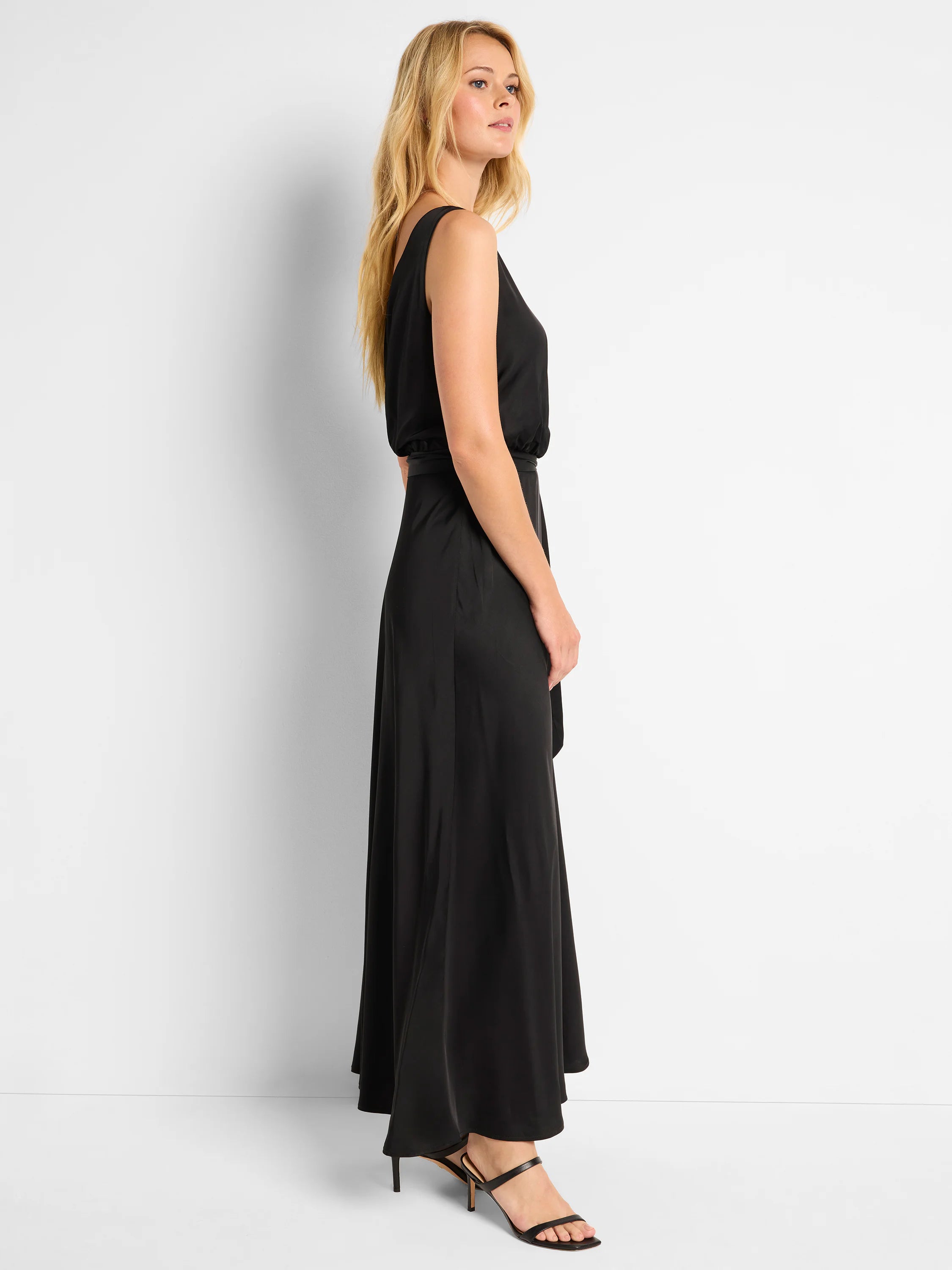 Black sleeveless maxi dress with a wrap-style waist and A-line skirt.