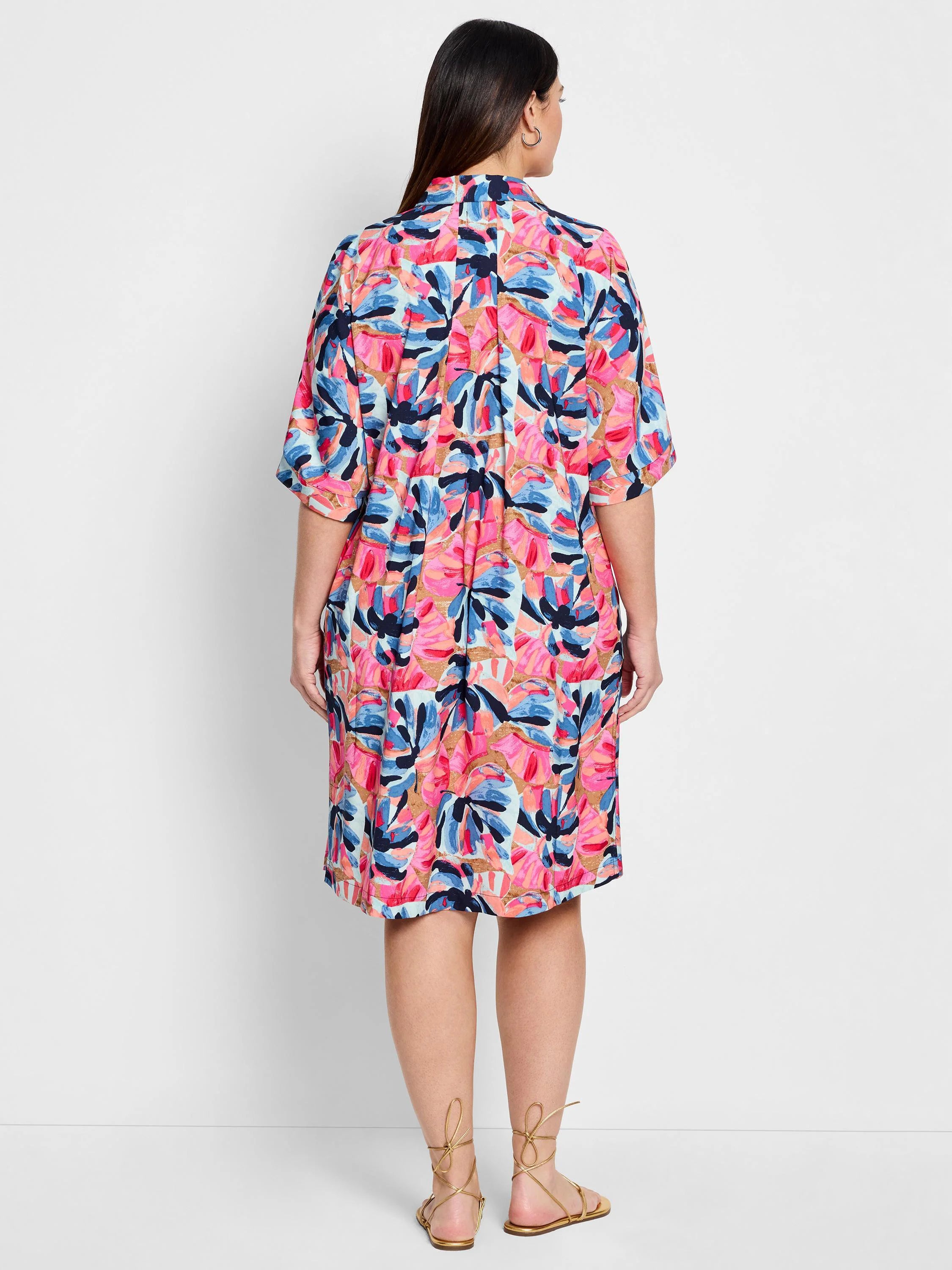 Pink, blue, and peach abstract floral print knee-length shirt dress; short sleeves.