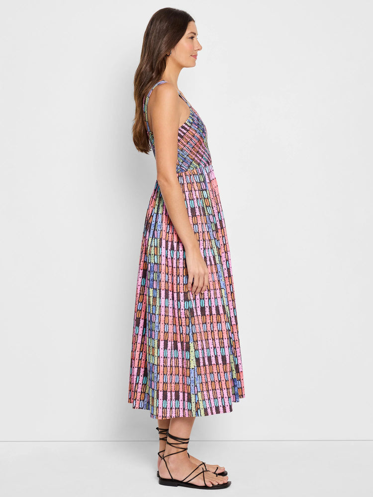 Midi-length sleeveless dress, multicolored patterned fabric with pink, orange, teal, and black.  A-line silhouette.