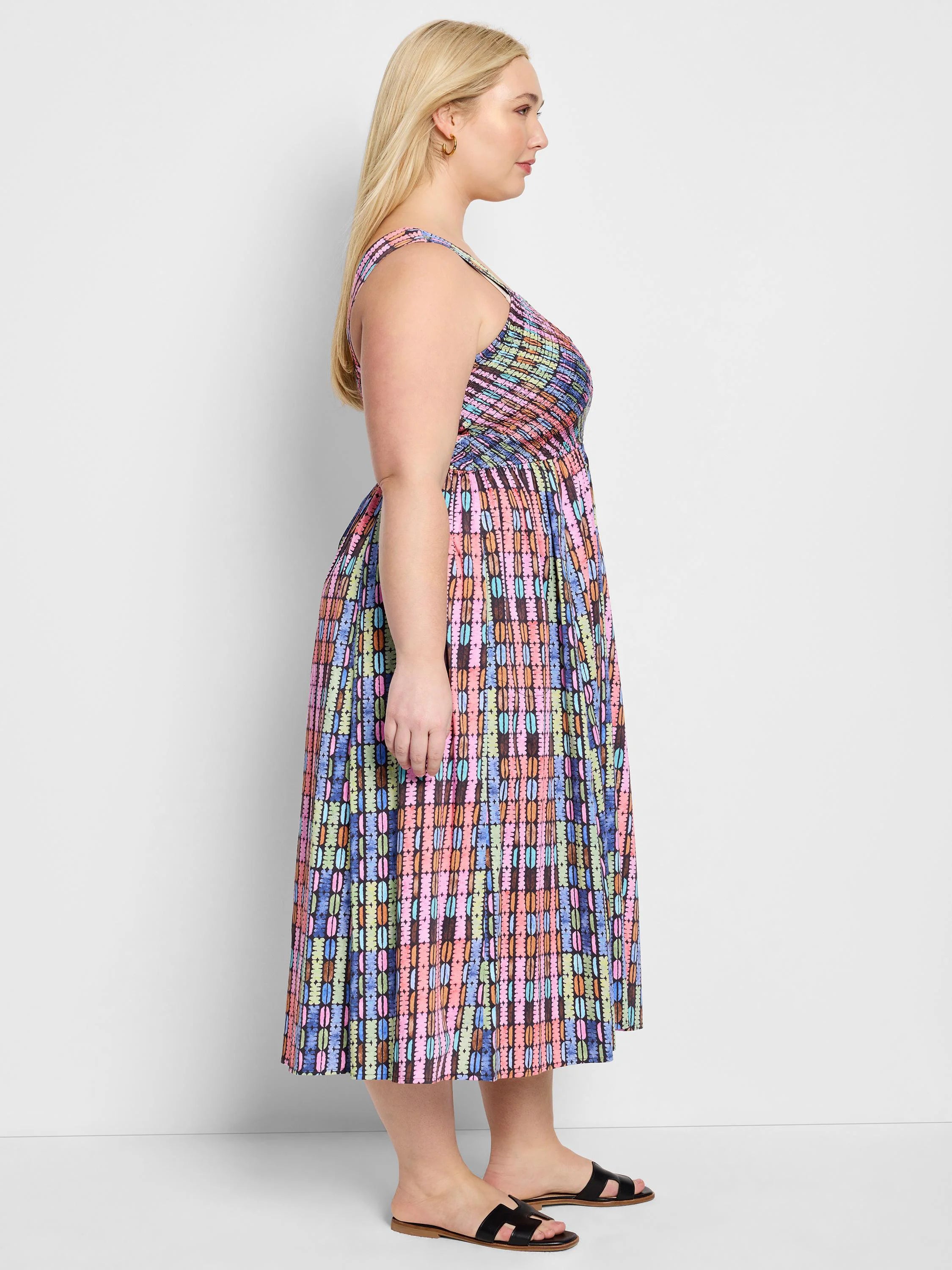 Midi dress, sleeveless, V-neck.  Multicolored vertical stripes; pink, blue, green, orange, brown on a dark background.