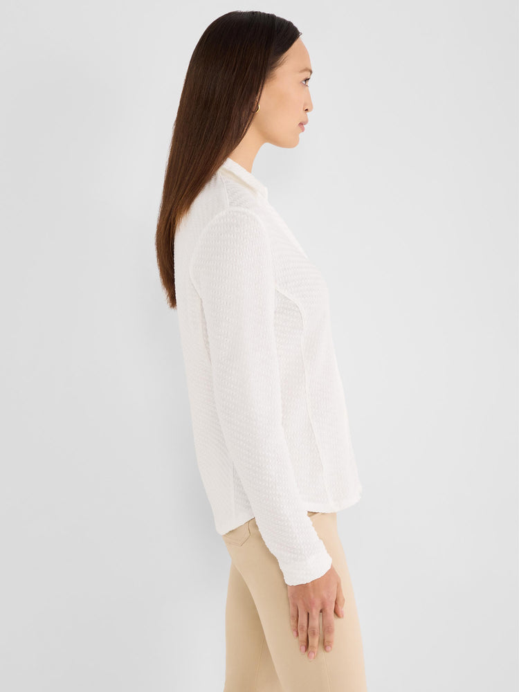 White textured knit collared blouse featuring a semi-fitted silhouette and long sleeves.