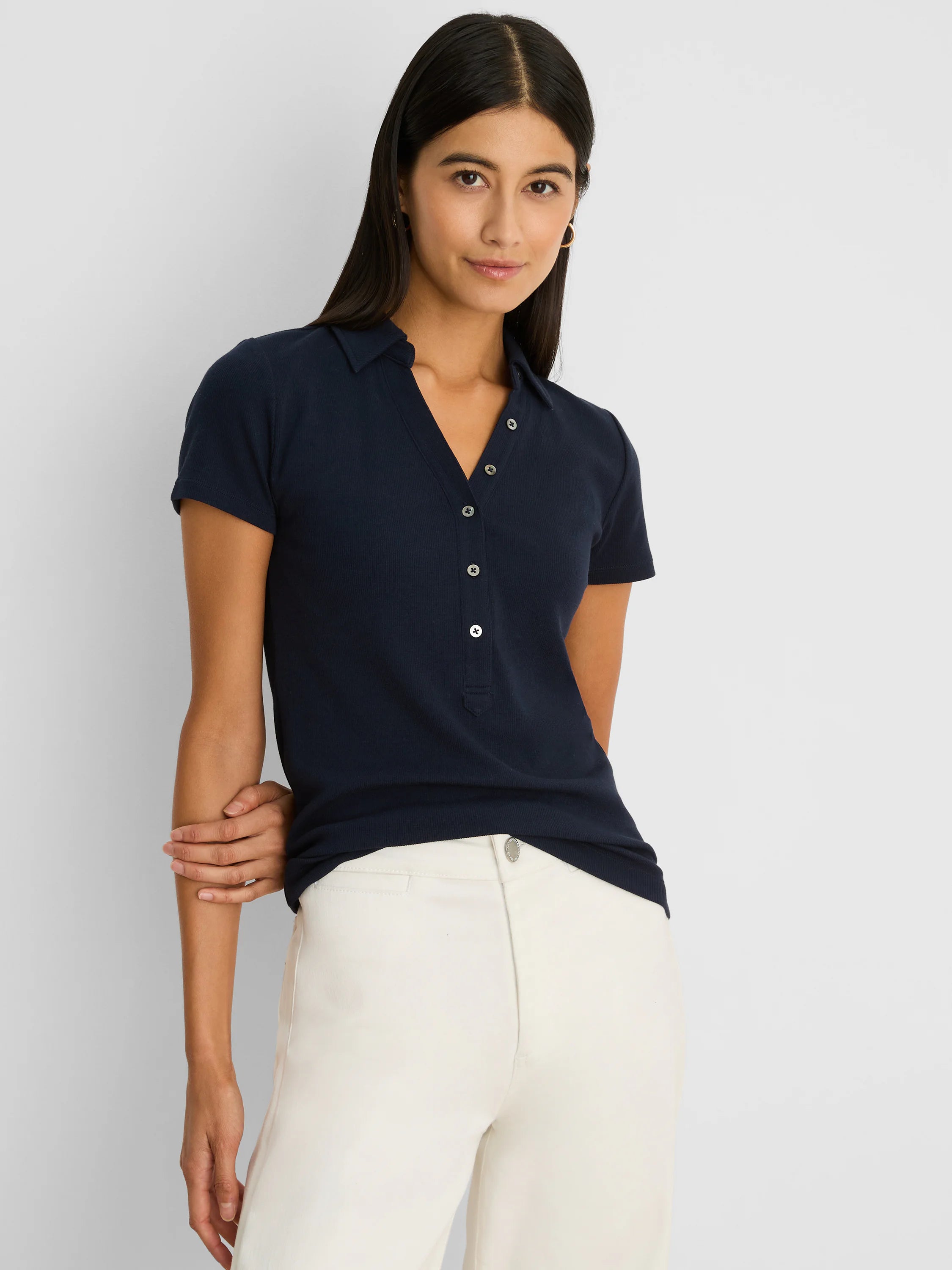 Navy ribbed knit short sleeve polo with a pointed collar and light-colored button placket.