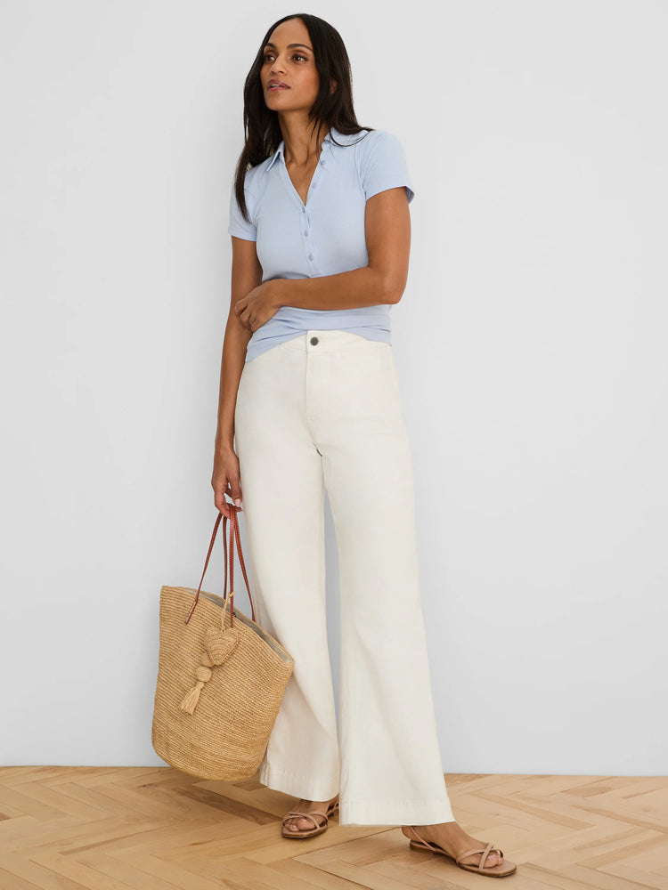 Light blue ribbed knit short-sleeve polo shirt with a collar and button placket.