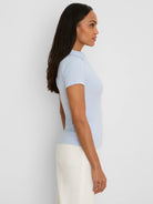 Light blue ribbed short sleeve polo. Fitted with a collar.