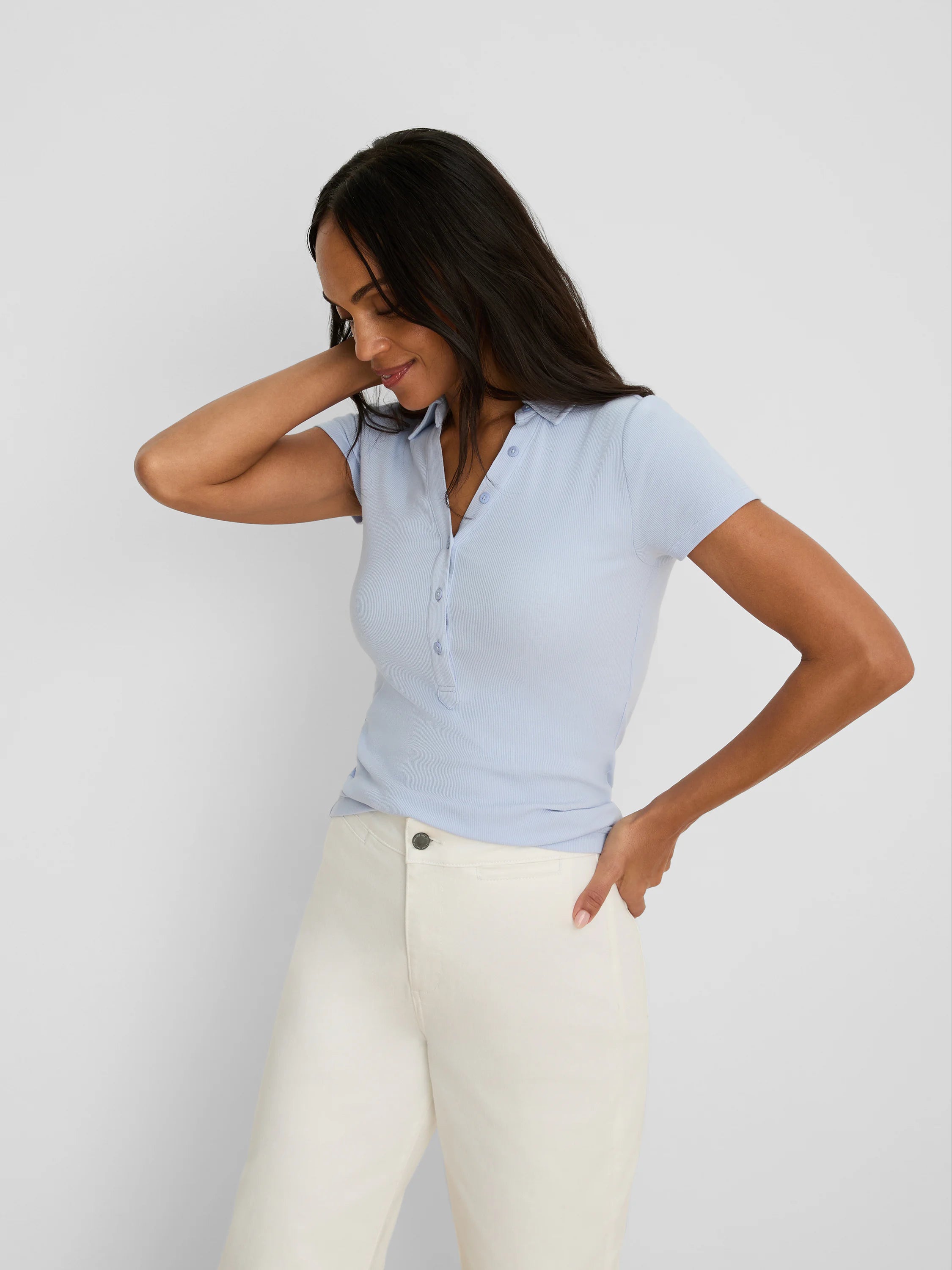 Light blue, fitted knit rib short sleeve polo with collar and partially unbuttoned 3-button placket.