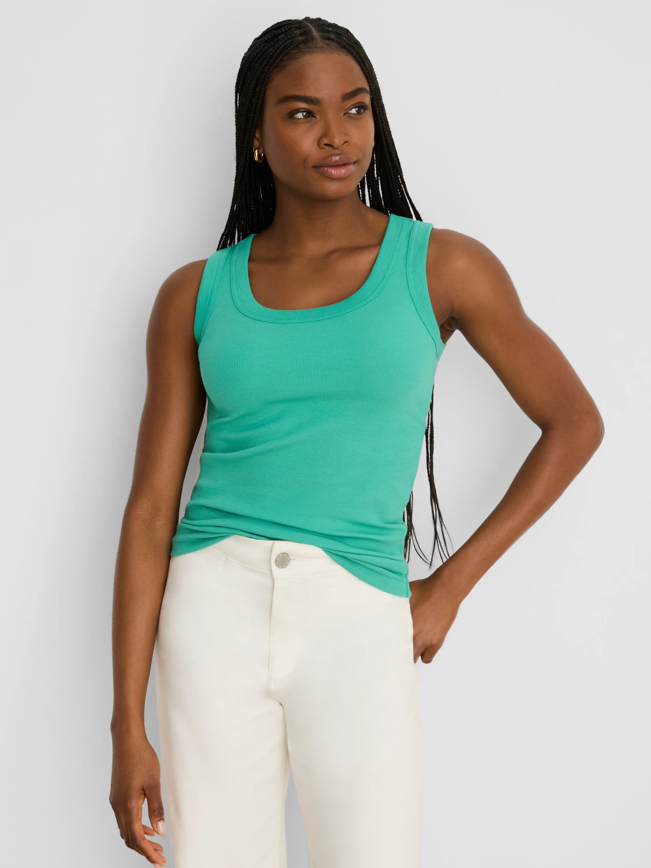 Teal green ribbed scoop neck tank top, worn fitted.