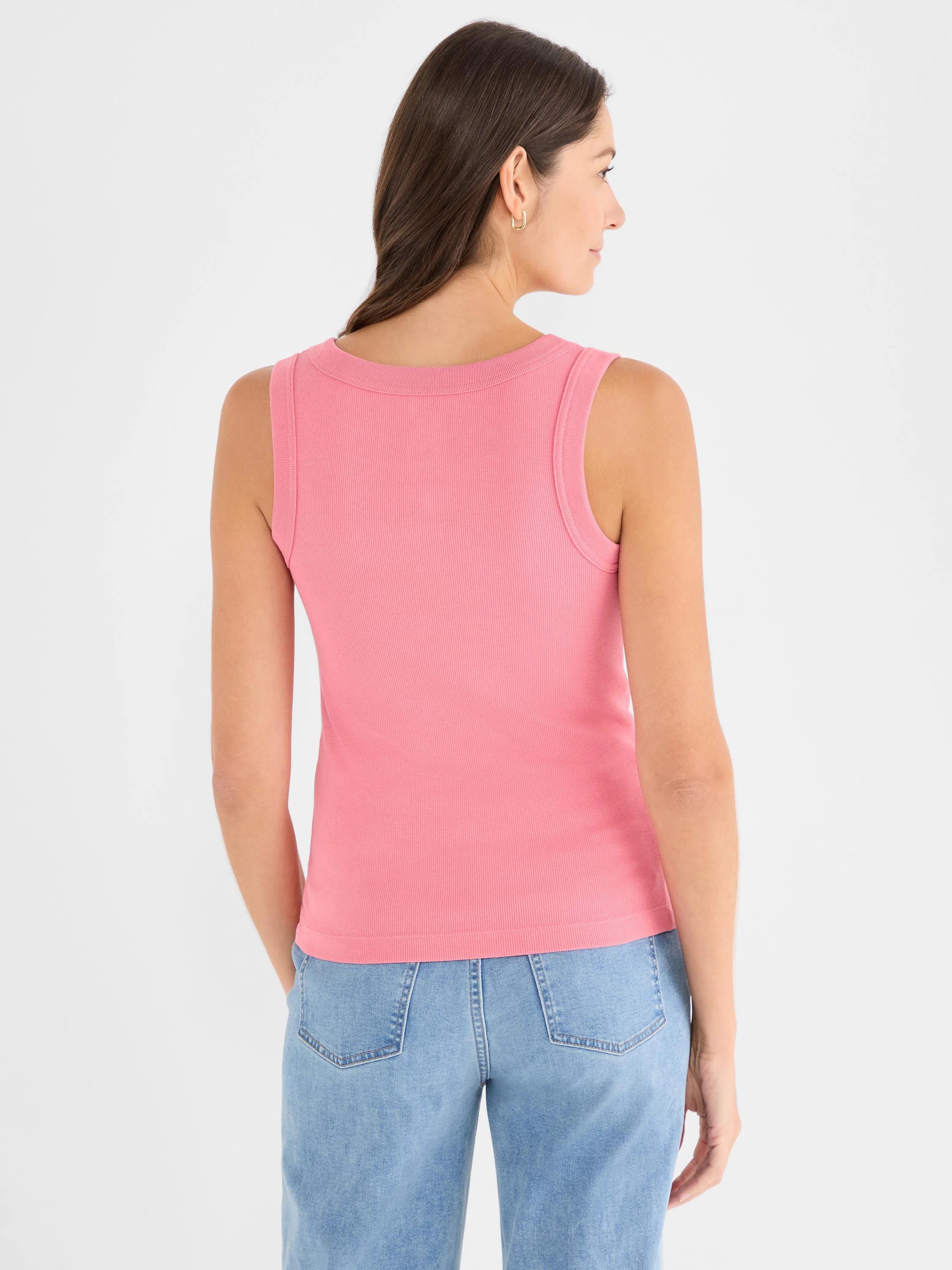 Rose pink ribbed knit tank, modeled from the back. Features a rounded neckline and fitted silhouette.