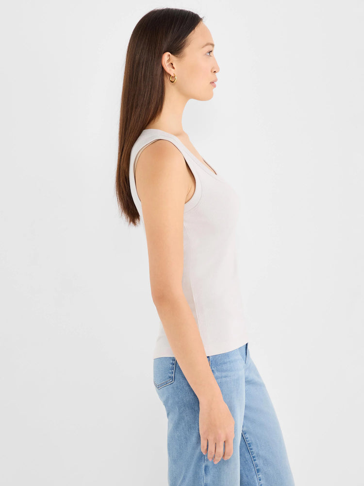Light grey ribbed knit scoop tank. Model wears it in profile.