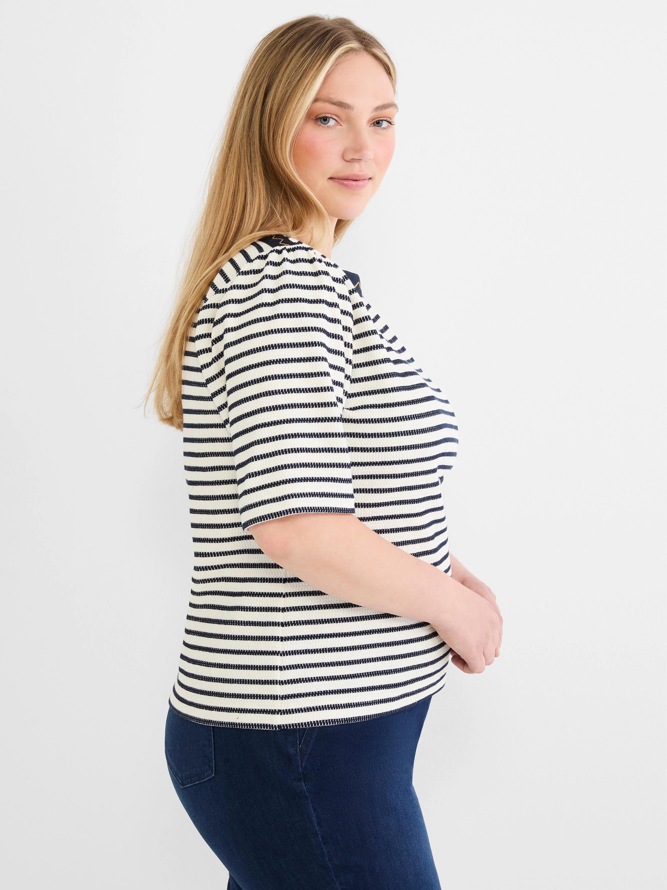 Cream and navy horizontally striped boatneck top with textured embroidery and short sleeves.