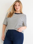 Cream & navy striped textured boatneck top with 3/4 sleeves and gold embroidery on the navy neckline trim.