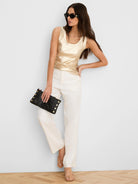 Shimmering gold ribbed tank top with a scoop neck.