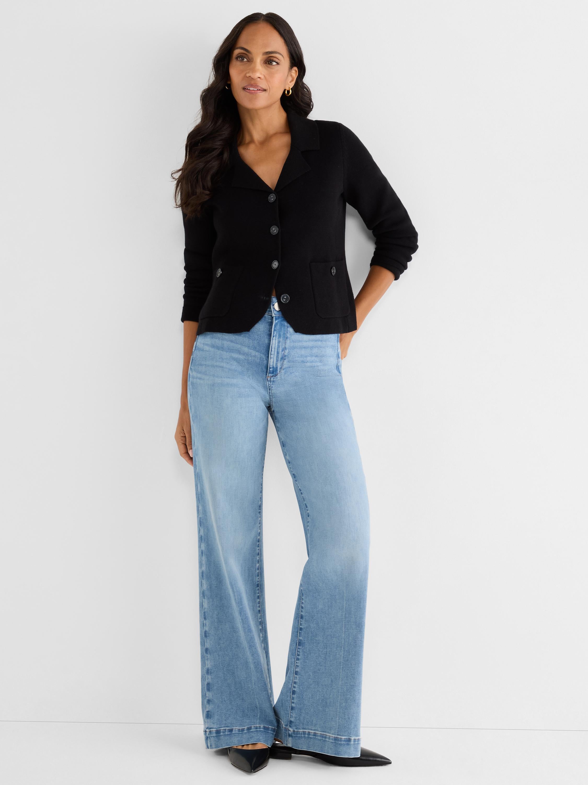 Fitted black collared cardigan blazer featuring a button front, patch pockets, and three-quarter sleeves.