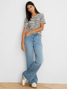 Cream, navy, and tan spacedye tuck stitch sweater tee with short sleeves and a rounded neck.