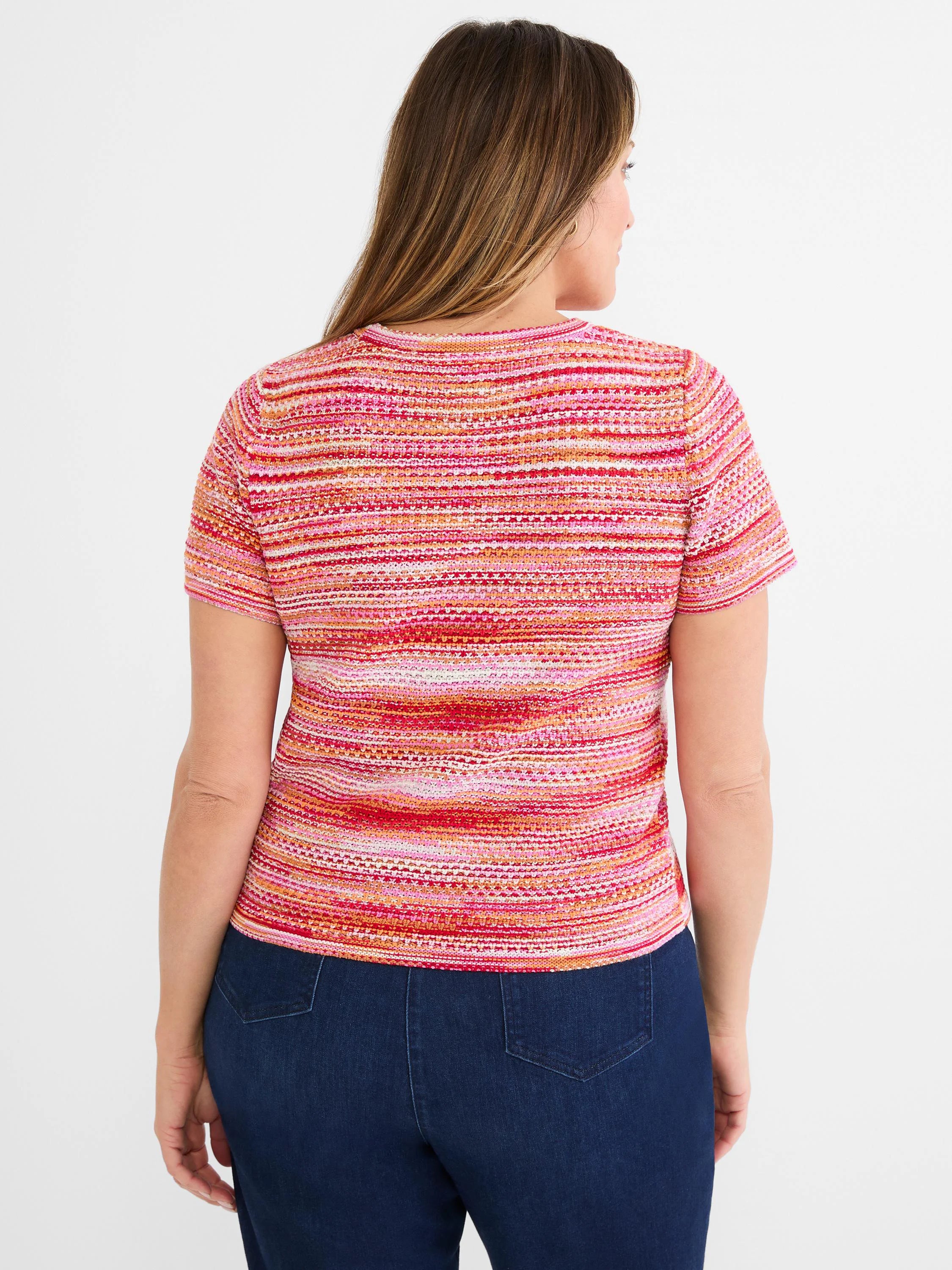 Pink, orange, and white spacedye knit short-sleeve sweater tee with horizontal stripes and tuck stitch texture. Back view.